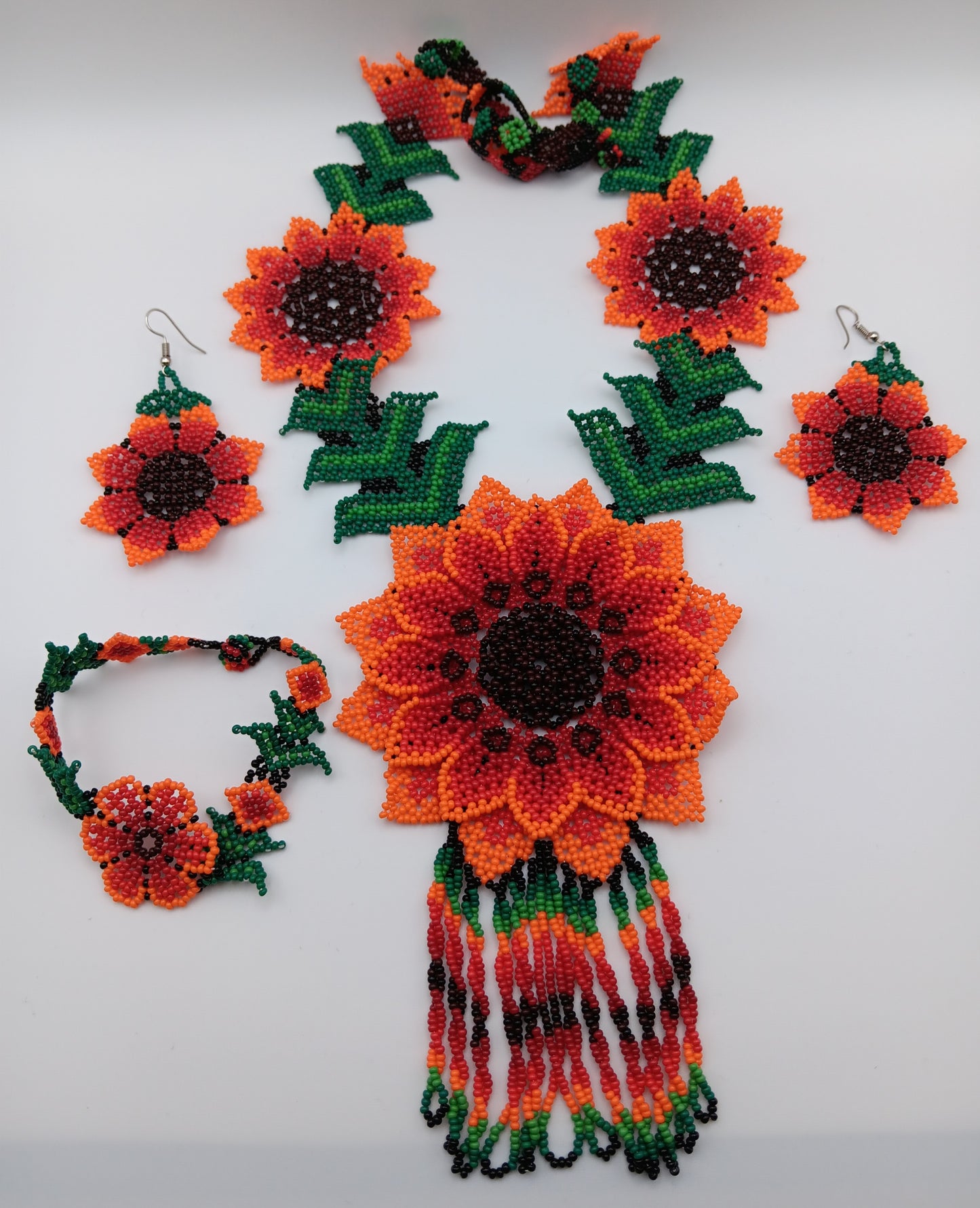 Necklace, earrings, and bracelet set.