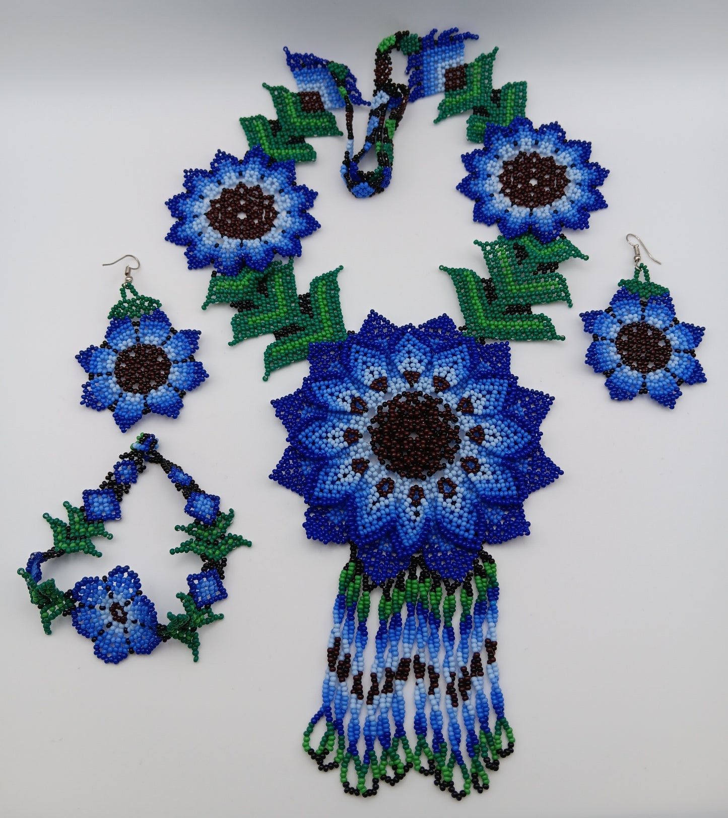 Necklace, earrings, and bracelet set.