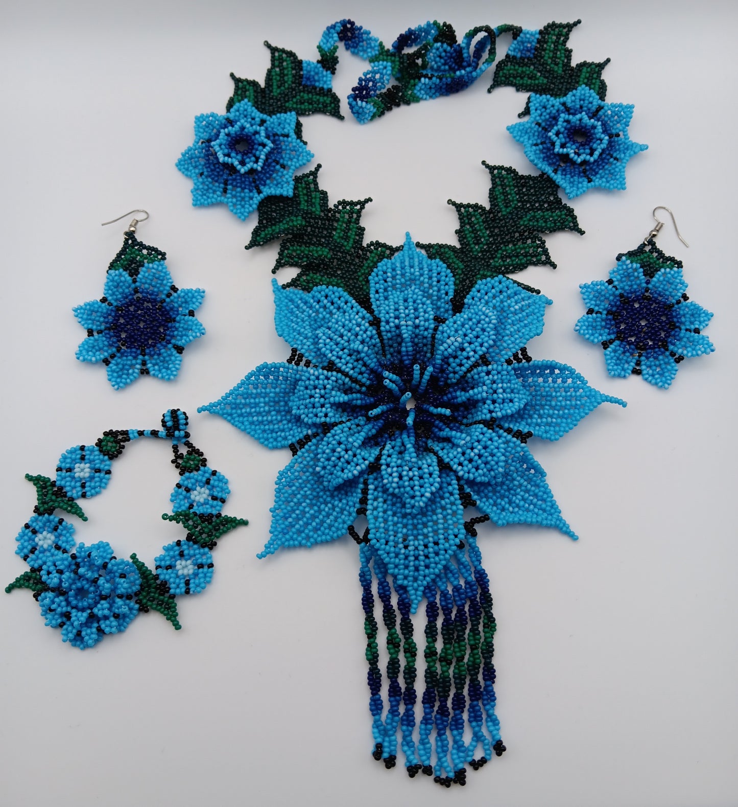 Necklace, earrings, and bracelet set.