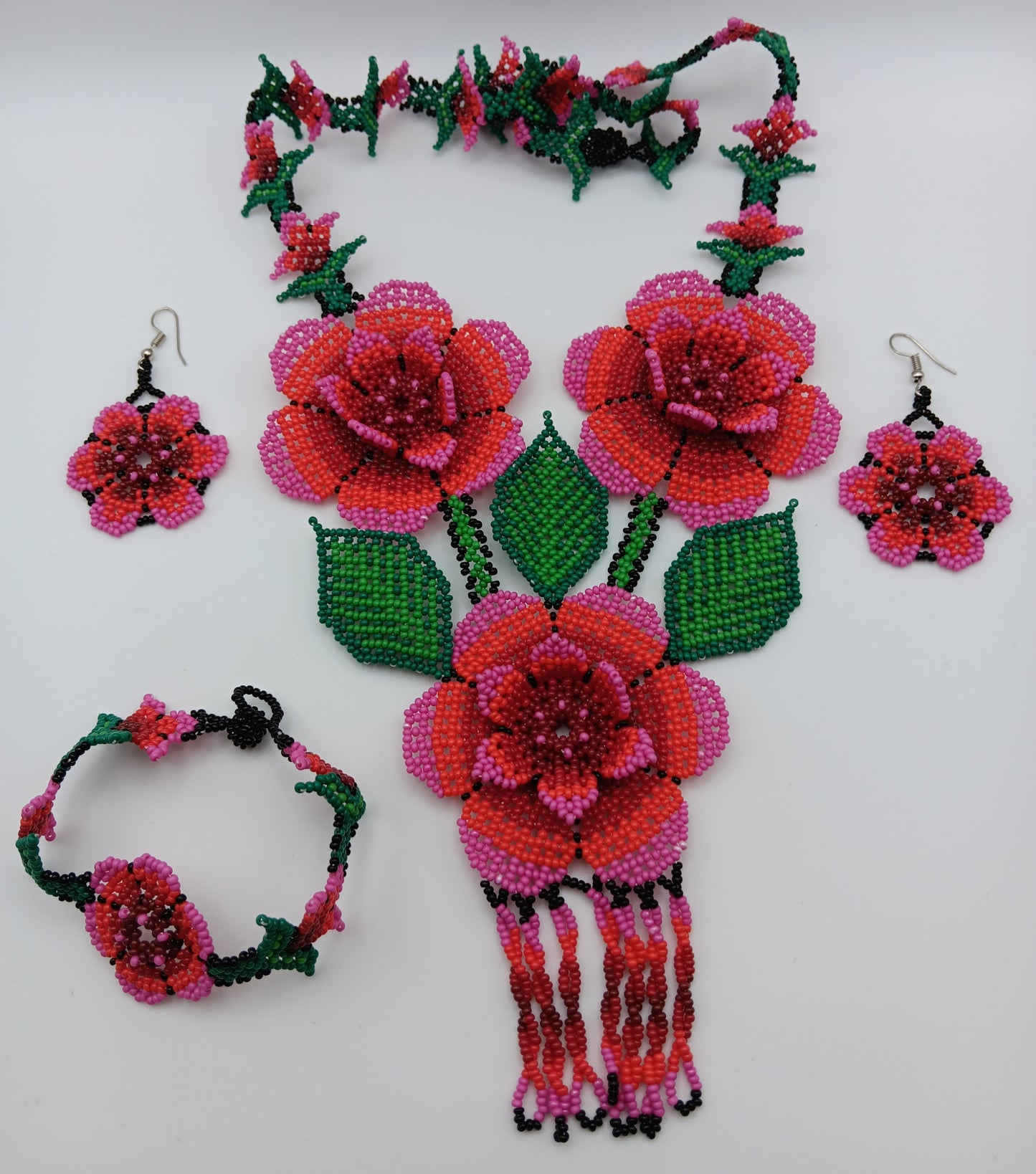 Necklace, earrings, and bracelet set.