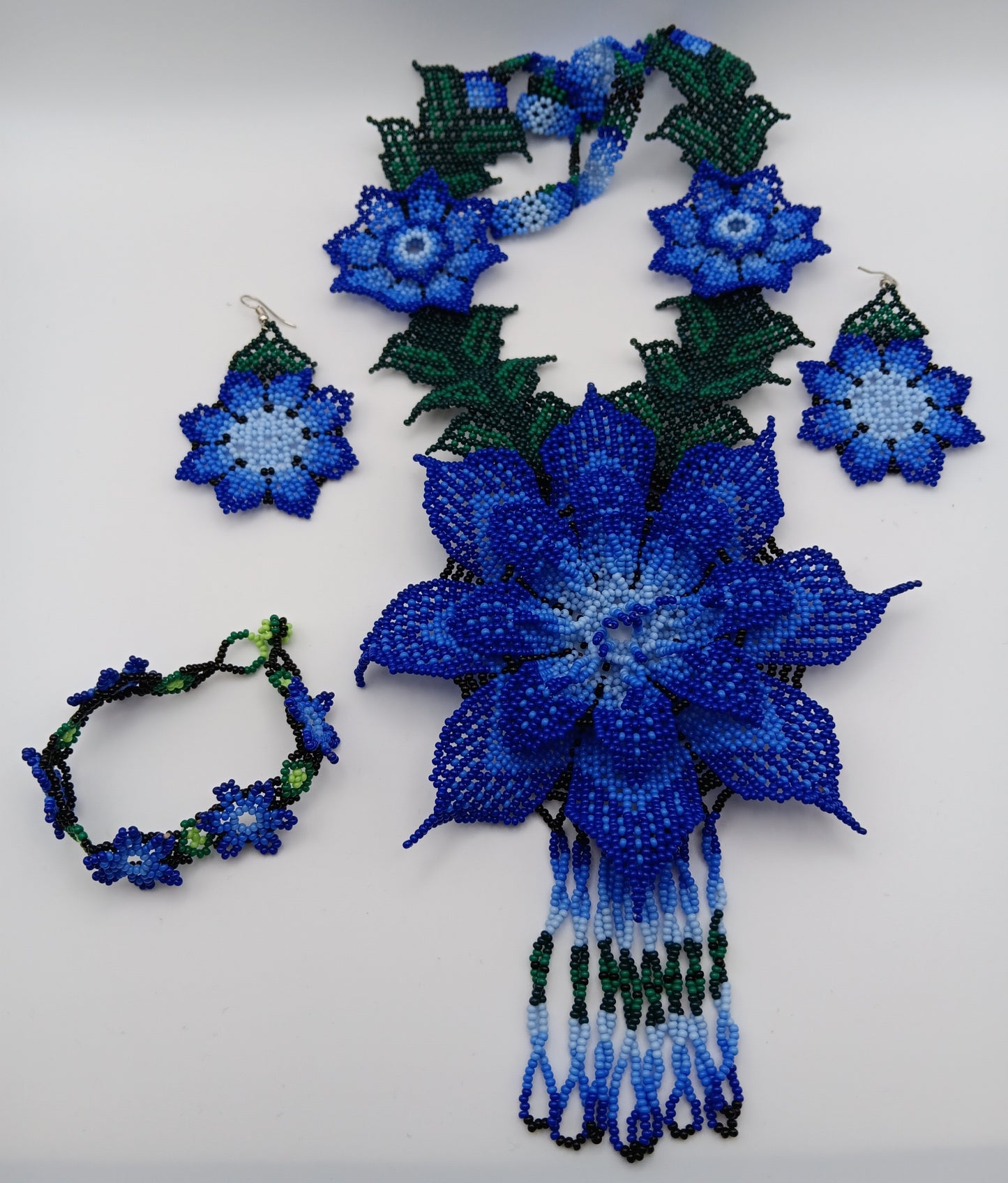 Necklace, earrings, and bracelet set.