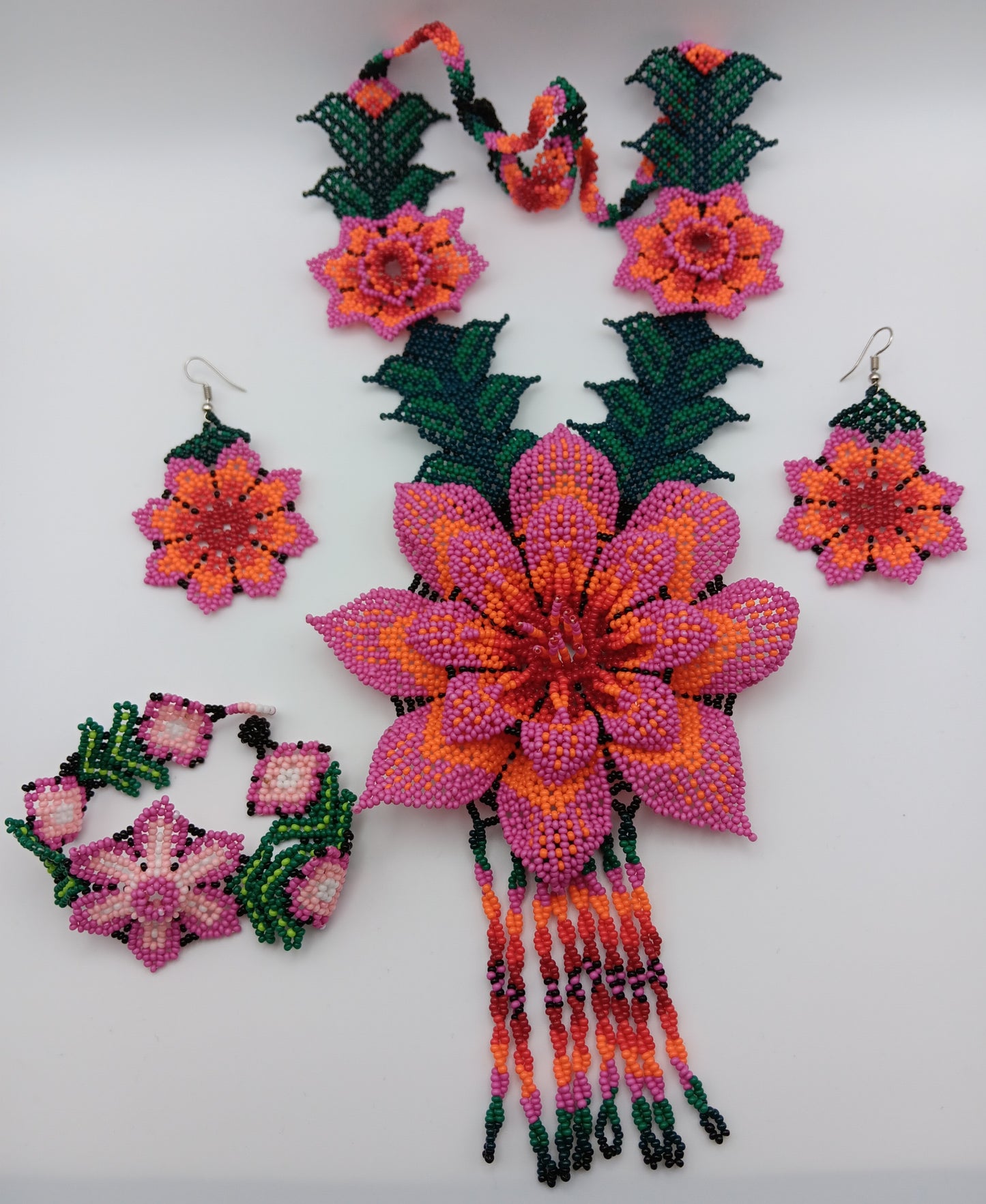 Necklace, earrings, and bracelet set.